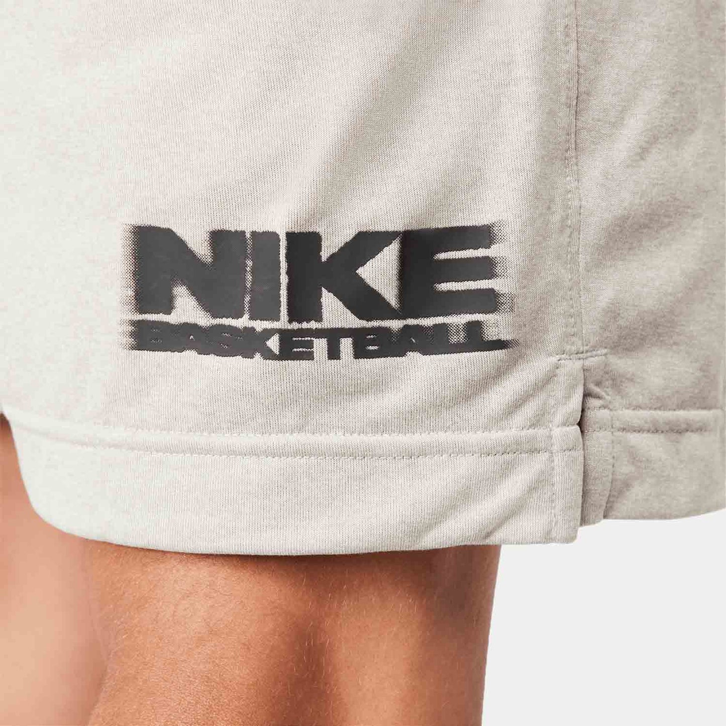 Up close view of emblem on the Nike Men's Dri-FIT 6" Reversible Basketball Shorts.