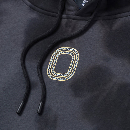 Up close view of emblem on the Overtime Aura Dye Hoodie.