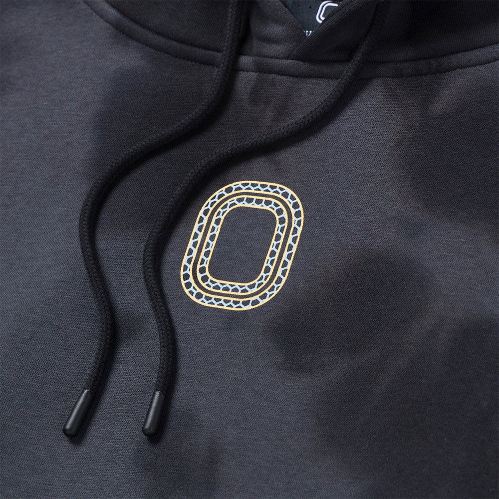 Up close view of emblem on the Overtime Kids' Aura Dye Hoodie.