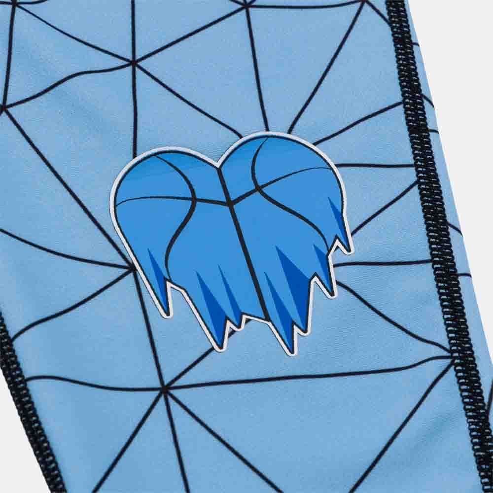 Up close view of cold hearts emblem on the Overtime Kids' Cold Hearts Valid 3/4 Compression Tights.