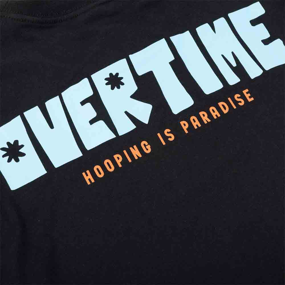 Up close, rear view of the Overtime Hip Bloom Tee.