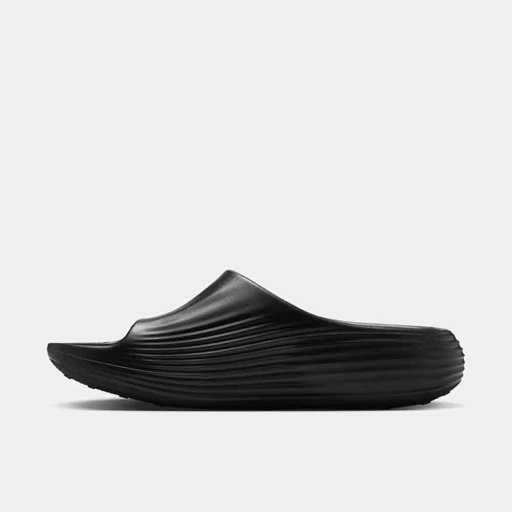 Side medial view of the Nike ReactX Rejuven8 Slides.