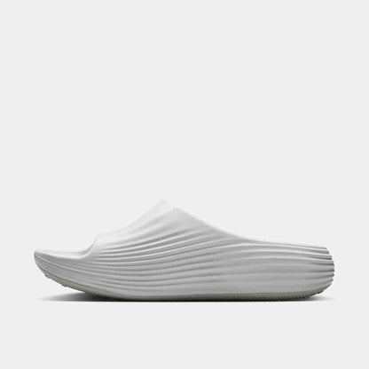 Side medial view of the Nike ReactX Rejuven8 Slides.