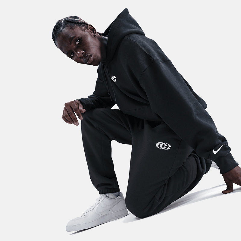 Side view of the Nike Caitlin Clark Fleece Cuffed Basketball Pants.