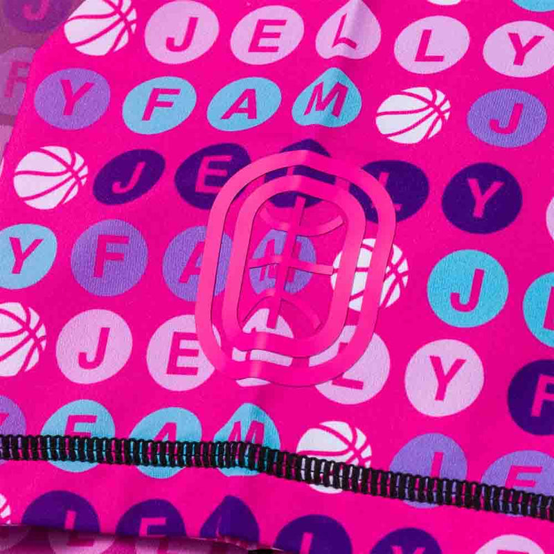 Up close view of emblem on the Overtime Jelly Fam Valid Compression Tee.