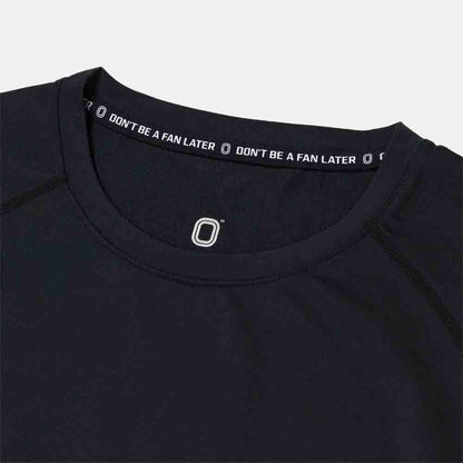 Up close view of emblem on the Overtime Kids' Valid Compression Tee.