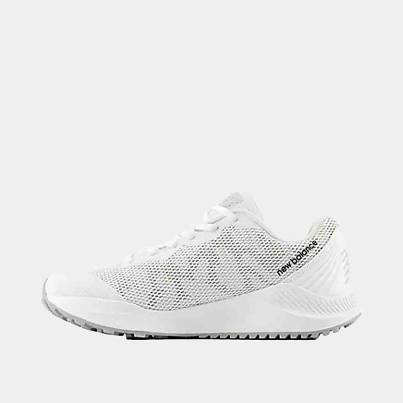 Side medial view of Kids' New Balance FuelCell v7 Baseball Turf Shoes.